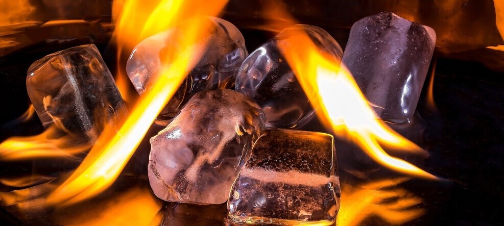 ice cubes in a fire to symbolize hot and cold