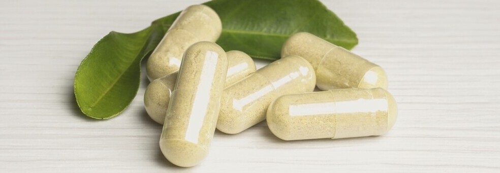 pills and leaves used as supplements